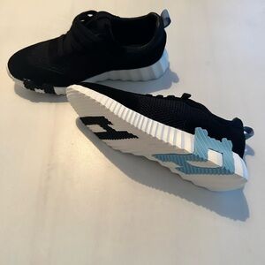 Stylish Black and White Sneakers with Blue Accents